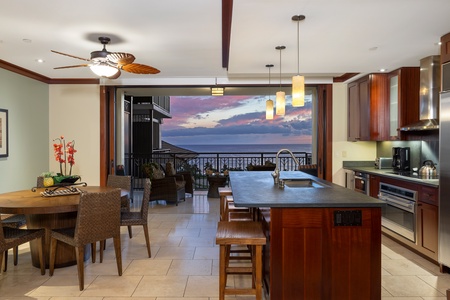 Enjoy the seamless flow between the kitchen and dining area with seating and expansive views.