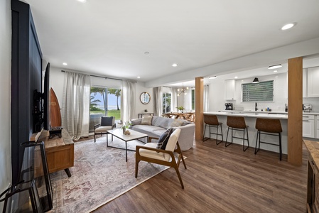 Expansive backyard surrounded by lush tropical landscaping, perfect for outdoor activities and relaxation.