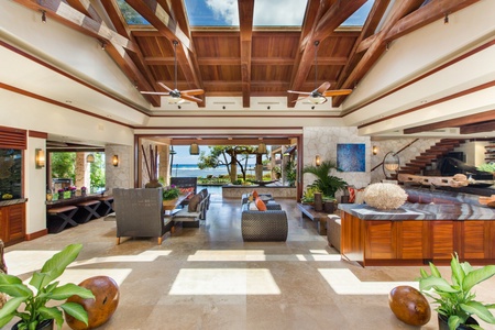 Floating stone pathways and tropical landscaping create a memorable entrance experience from the moment you arrive.