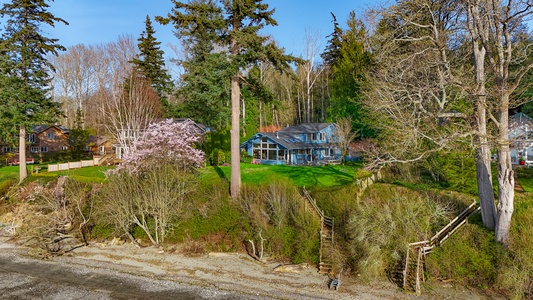A cozy waterfront cabin retreat steps away from the ocean, offering a peaceful escape into nature. Welcome to Sunny Blue Beach House!