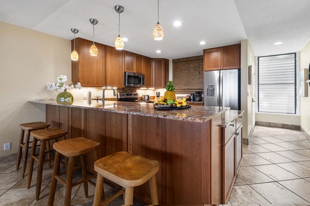 Enjoy casual conversations over morning coffee at the kitchen island, which comfortably seats three.
