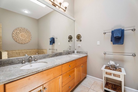 The primary ensuite has dual sinks and plenty of storage.