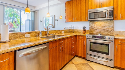 This gorgeous kitchen features stainless steel appliances and a beautiful view.