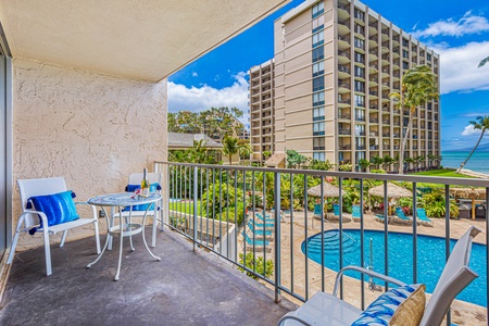 Relax on the lanai with a view of the resort pool, the perfect spot to enjoy a morning coffee or an evening drink.