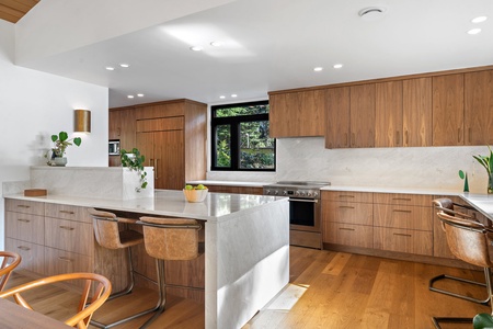 The kitchen area has wide counter spaces for convenient meal preparation.