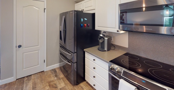 The kitchen has an open floor plan and breakfast bar seating.