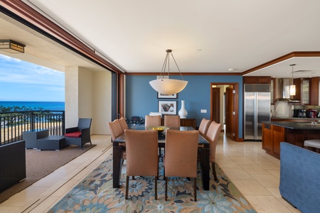 The living area and kitchen with bar seating.