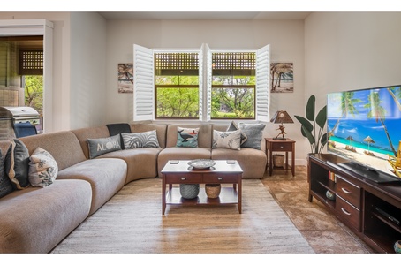 On the large ground floor, you’ll find the open-plan living, kitchen and dining area, as well as the powder room, and laundry room that connects to the garage through the internal door.