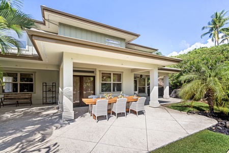 Bright and airy backyard space with ample seating and a sparkling pool.