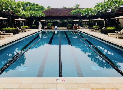 Hualalai Resort has an expansive lap pool with lounging areas.