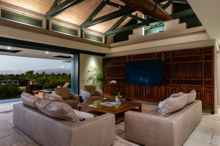 Open dining area with comfortable seating, conveniently connected to the kitchen and outdoor space.