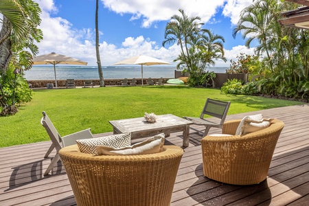 Lounge seating along the seawall creates a front-row spot for sunrise views, calm water mornings, and evenings by the shoreline