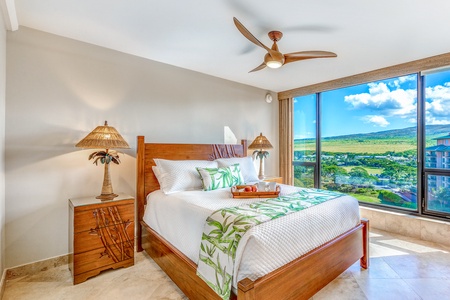 Relax in the serene secondary bedroom at Mahana 1119 and wake to lush tropical garden views.