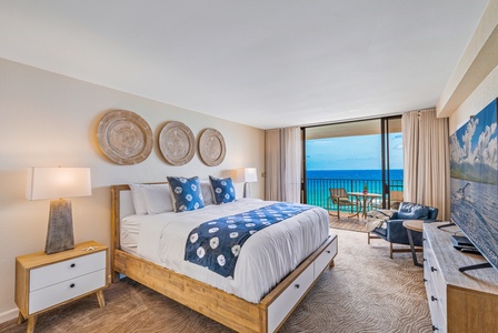 This serene bedroom boasts direct access to a private lanai with stunning ocean views, perfect for starting or ending your day in relaxation.