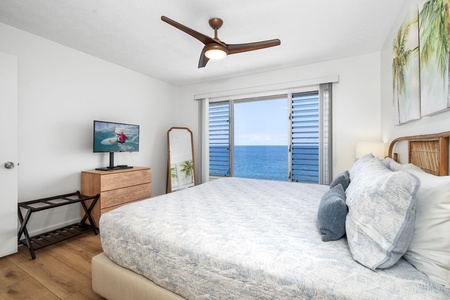 The primary suite blends comfort and serenity with ocean breezes and calming coastal tones.