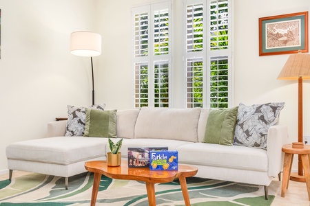 Island-inspired living room with direct lanai access and plenty of natural light.
