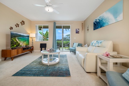 Relax in the bright and airy living room, with large windows and easy access to the lanai.
