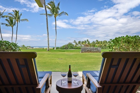 Closer view of lanai loungers with ocean views.