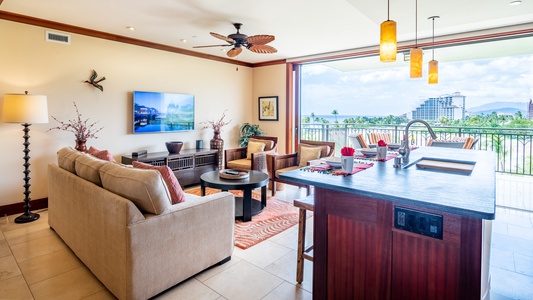 A spacious kitchen island and living area invite you to cook, dine, and relax in comfort while soaking up the island ambiance.
