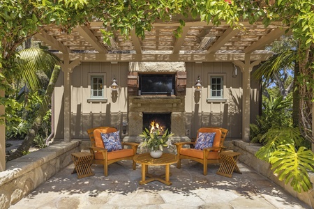 The perfect spot for a movie or sports! Outdoor fireplace and tv.