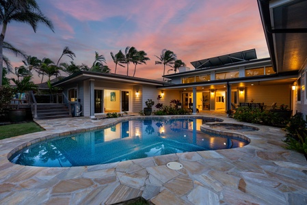 Cozy spot to sit back, relax, and enjoy views of the pool and tropical garden.