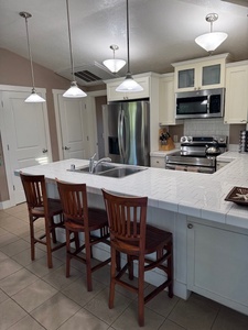 Open kitchen featuring a breakfast bar, good for 3.