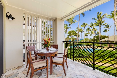 Your private lanai overlooks swaying palms and sparkling turquoise waters, perfect for morning coffee or romantic dinners under Hawaiian skies.