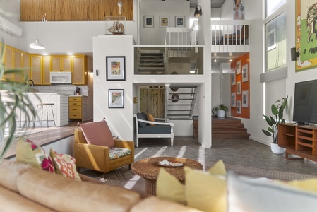 Relax in the inviting living room, designed for comfort with plush seating and natural light.