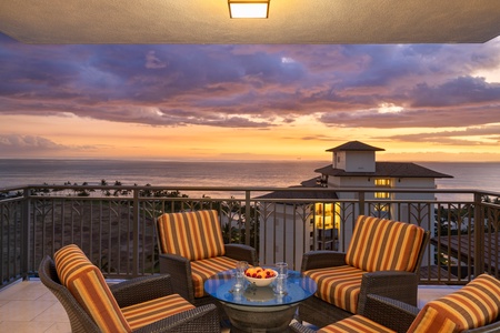 Inviting lanai space offering a panoramic view of the ocean.