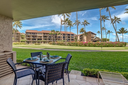 Enjoy meal prep at Papakea B-105’s spacious kitchen island with garden views from the lanai.