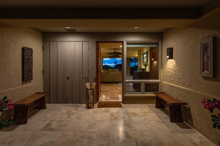 Inviting villa entryway warmly lit for evening arrivals.