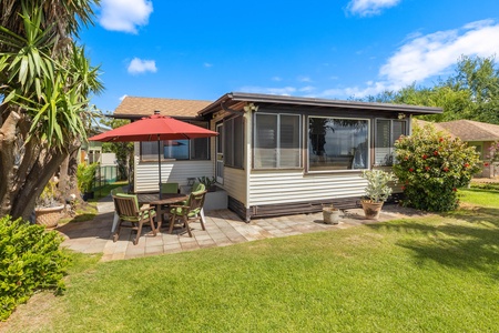 The garden yard with outdoor furniture.