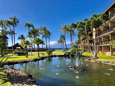 Relax by the koi pond near Papakea B-105, framed by lush gardens and sea views.