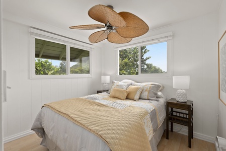 Drift off to sleep beneath the gentle whir of your tropical ceiling fan, while lush greenery frames your window views.