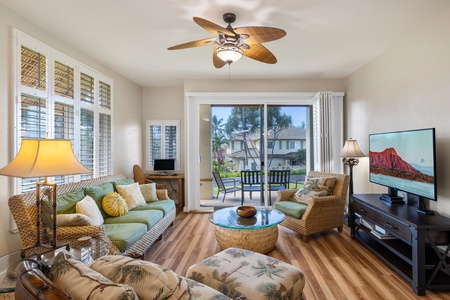 Cozy up in a sunlit living room at Kai Lani 14B, perfect for unwinding after a day of adventure.