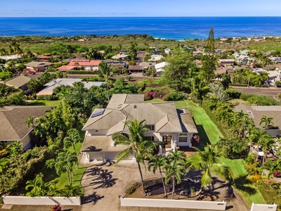 Aerial view of the property with stunning proximity to coastline and town amenities.