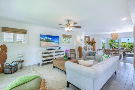 Sink into comfortable seating in the spacious living room where island-inspired decor provides a welcoming place to gather after exploring Kauai.