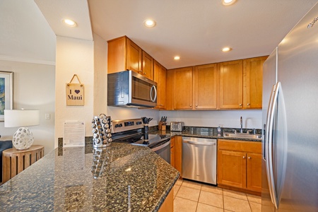 Kaanapali Shores 903’s kitchen island offers extra prep space and a casual dining spot.