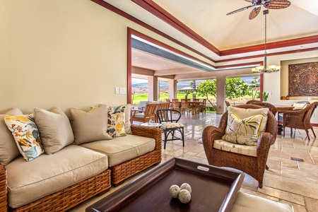 Comfort meets island charm in this inviting lounge area — ideal for movie nights or quiet reading.