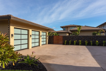 The dedicated parking spaces with privacy gate between the driveway and the house.