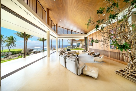 Open living area with panoramic ocean views, chic furnishings, and abundant natural light.