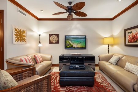 A cozy living area with leather sofa and loveseat.