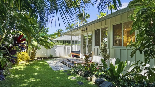 Step out into serenity—your staycation dream continues with private garden paths and tropical greenery.