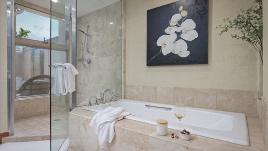 The ensuite bathroom has two vanity spaces, separate shower and a large soaking tub.
