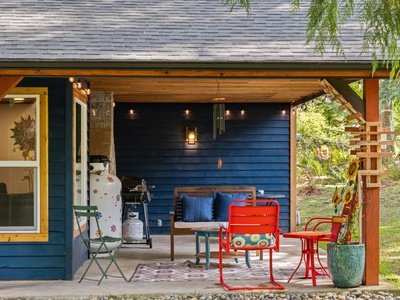 Start your day with coffee or end it with wine on the inviting front porch, perfect for soaking in the wooded serenity.