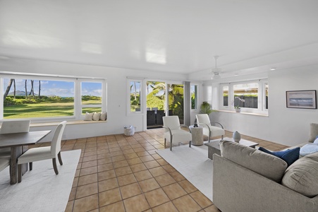 Just beside the dining area, you'll find an additional TV room with seating.