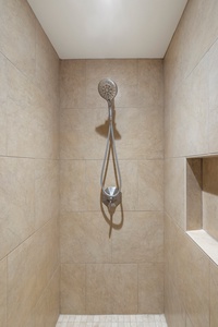 The walk-in shower provides a refreshing way to unwind after a day of exploring Hawaii’s beaches and lush landscapes.