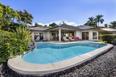 Large pocket doors bring the outside in with this Tropical design!