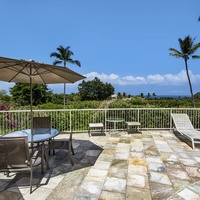 Pool with outdoor seating and sun beds