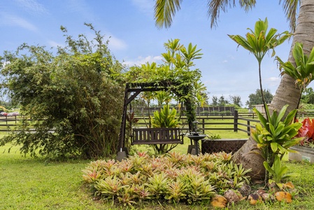 Unwind in the garden swing surrounded by island greenery—perfect for your morning coffee or sunset wind-down.